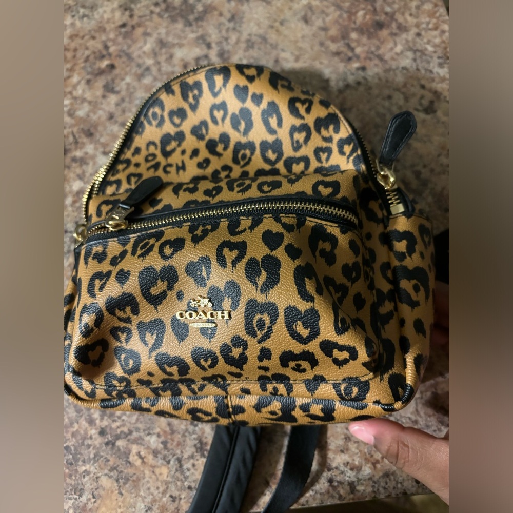 Authentic new without tags coach leopard print small back pack purse